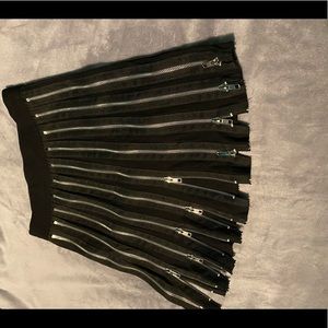 Black zipper skirt. All zippers can we completely zipped up or down.